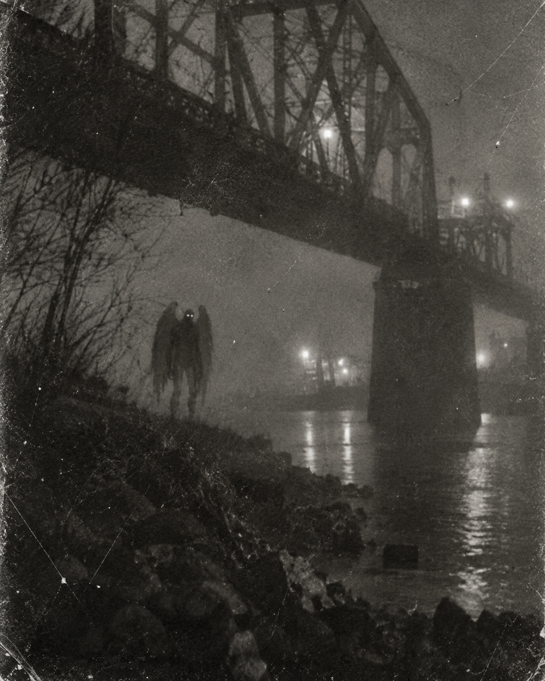 Old photograph of a winged Mothman-like figure beneath a steel bridge